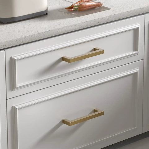 Heavy Duty 30 Pack 5 Inch Center Cabinet Pulls Featuring Slick Champagne Bronze Finish on white cabinet drawers.