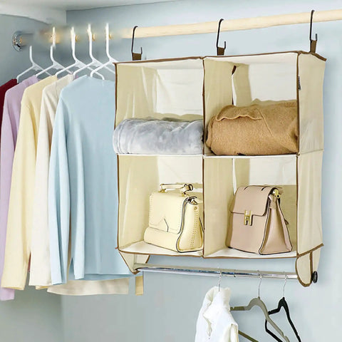 Total Closet Game Changer Hanging Purse Organizer for Wardrobe dustproof handbag storage rack with handbags and sweaters.