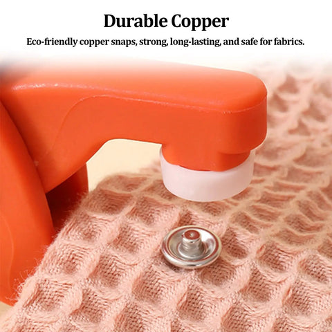 Close-up of Heavy Duty Copper Snap Button Kit with press tool on fabric, showcasing copper snap button detail.