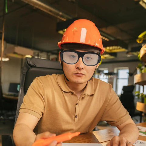 Professional Grade Welding Safety Glasses With Flip Up Lens For Argon Arc And Metalworking 6 Pack Tough As Nails Eye Protection worn by worker.
