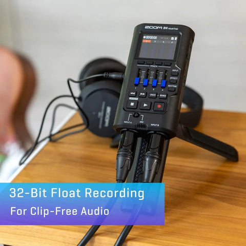Ready To Roll 32 Bit Float MultiTrak Recorder And Stereo Bouncing Bundle featuring dynamic mic, headphones on wood table.