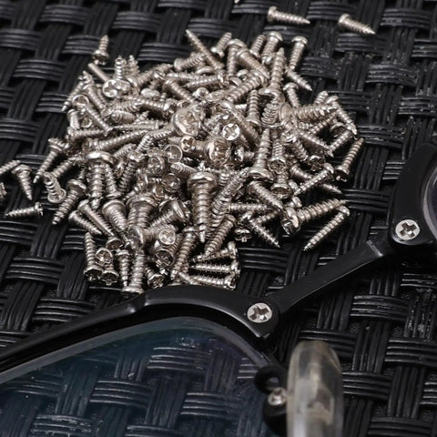 1200 Piece Miniature Self Tapping Screw Set Featuring Crosshead Drive And Rugged Carbon Steel Build For Diy Repairs And Furniture Assembly on black background.