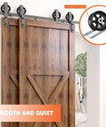 Six By Two Inch Cast Iron V Groove Wheel With Precision Roller Bearing For Heavy Duty Sliding Gate And Track Jobs Built Tough To Handle Any Load You Throw At It While Delivering Smooth Daily Glides In Classic Black Two Pack mounted on wooden barn doors.