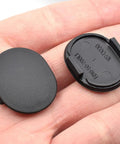 2 Pack E01650796 Windshield Cowl Grille Screw Hole Cap Rubber Covers shown in hand, black plastic, Mazda Miata MX5