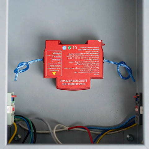 Reliable Auto Aerosol Fire Extinguisher A Straight Up Weekend Warrior Must Have For Under The Hood Emergencies Quick Automatic Engine Bay Suppression Compact Car Safety Gear visible in an electrical housing.