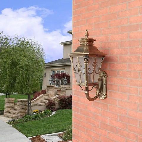 Rustic Exterior Wall Lantern Heavy Duty Outdoor Light Fixture For Front Porch Durable All Weather Barn Style Sconce With Solid Antique Brown Finish mounted on a brick wall.