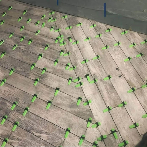 Tiles set with LevTec One Eighth Inch Tile Leveling Clips For Bathroom And Kitchen Flooring Plastic Leveling Gapping System.