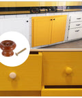 Upgrade Your Kitchen Game With These Swell Red Wooden Cabinet Knobs And Round Drawer Pulls Perfect For Dresser Furniture Makeovers And Top Notch Hardware Upgrades That Look Rad In Any Room. Glossy red wooden knob with M4 bolt on yellow kitchen cabinetry.