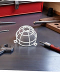 Heavy Duty Fire Sprinkler Ceiling Cover With 6mm Mounting Hole Featuring Slick Mesh Safety Guard For Smoke Detectors and Decorative Metal Shield on workbench.