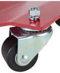 Close-up of heavy duty caster of Ultra Slick Auto Dollies For Moving Vehicles showcasing red steel frame and poly bearing wheel.