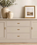 Stone top sideboard featuring Rock Solid Antique Brass Cabinet Pulls For Kitchen Cabinets And Hefty Drawers 3 Inch Hole Center.