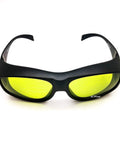 Heavy Duty Laser Safety Glasses Delivering Full Coverage Broad Spectrum Eye Protection For Uv To Far Infrared Range CE En207 with yellow lenses and a black frame.