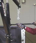 Beast Mode Hydraulic Pickup Truck Crane With 360 Degree Pivot And Integrated Hand Winch in use, showing the handle and hook.