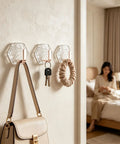 Hella Strong 10 Pcs White Hexagonal Water Ripple Self Adhesive Wall Hooks displayed with keys and a scrunchie.