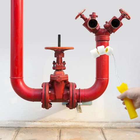 Grippy Pipe Paint Roller Handle Kit For Round Gas And Water Pipes painting red valves using a handheld roller.