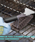 Heavy duty wire brush from Backyard BBQ Essential 5 Piece Grill Tools Set with cleaning cloth on grill