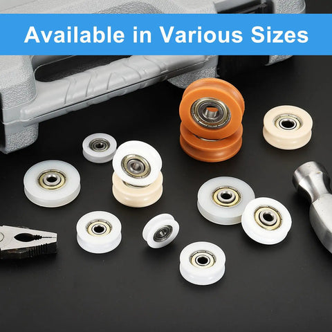 Top Shelf Nylon U Type Groove Bearings Features Twelve White Rollers Designed For Flat Out Smooth Gliding Motion On Heavy Duty Retractable Slides And Jigs scattered with various sizes on a black surface.