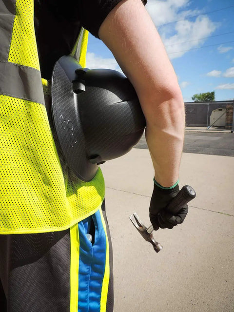 Worker with hard hat and hammer wearing PUG17 Lightweight Polyurethane Dipped Work Gloves Anti Static Puncture Resistant Secure Grip
