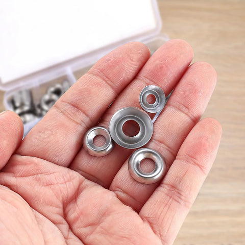 Close-up of stainless steel cup countersunk finishing washers, assorted #6–#12, held in hand.