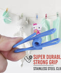 Dope Assorted Bag Clips Set, Solid 30 Pack PVC Food Sealer, Nifty Packet Locks, holding a blue clip against a colorful backdrop.