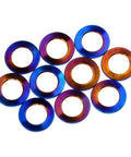 Badass Grade 5 Titanium Flat Washers For M5 Metric Bolts With Burnt Blue Finish 10 Pack displayed in a group, showcasing unique colors and design.