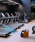 Heavy Duty Air Mover Blower Fan For Drying, Cooling, And Ventilating at gym, 355 CFM, orange unit in front of treadmills