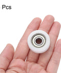 4 Pack Silent Roller Bearings 608ZZ Double Shielded Smooth Operator Pulley Wheels 8X30X11mm Nylon Idler Sleeve in hand.