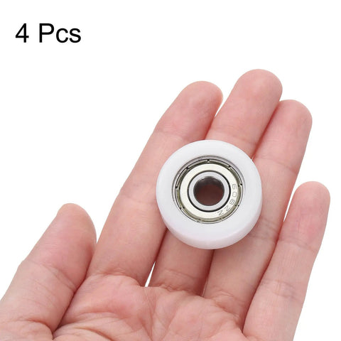 4 Pack Silent Roller Bearings 608ZZ Double Shielded Smooth Operator Pulley Wheels 8X30X11mm Nylon Idler Sleeve in hand.