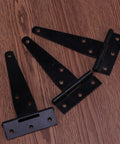 T Shape Door Hinges Set, 24 Pcs Black Iron Triangle Hinges With Six Screw Holes on wooden surface