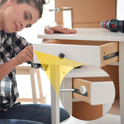 Woman installing Badass Pa66 Nylon Drawer Rollers With M6 Thread Studs giving slick glide action in a dresser drawer.