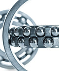 Close-up of Bulletproof Build Two Inch Chrome Steel Bearing Balls G25 Precision in bearing assembly for machinery use.