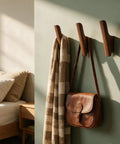 Rock-Solid Natural Walnut Wood 4 Pack Wall-Mounted Coat Hooks for a Super Entryway Glow Up handcrafted hooks holding a bag and scarf.