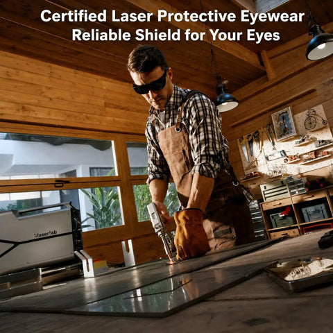 Man wearing Shop Ready Laser Safety Glasses Featuring Od6 Plus And Od7 Plus Filters while cutting metal in workshop.
