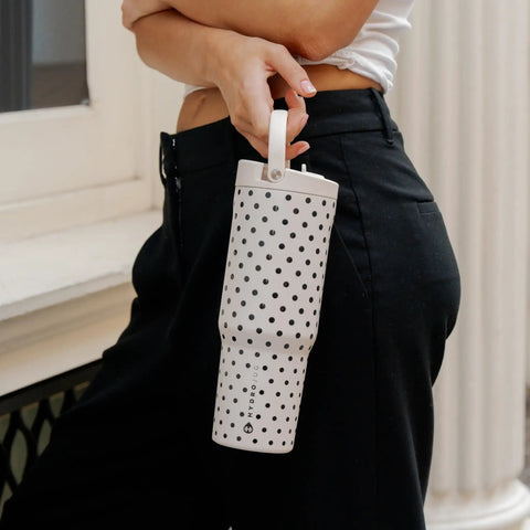 32 Oz Insulated Stainless Steel Water Bottle With Fly Polka Dot Drip And French Vanilla Finish Reusable Sport Flask in hand.