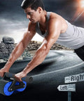 Man using Automatic Rebound Belly Wheel With Rock Solid Triangular Base And Multi Angle Core Training on a gym floor.
