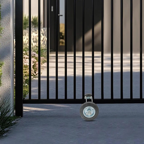 Heavy Duty Sliding Gate Hardware Kit With Rock Solid Double Roller Track Handles 600 Lbs close-up of gate roller on driveway.