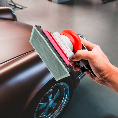 Pneumatic Palm Sander Kit With Random Orbital Action For Auto Body, Car Waxing And Woodworking in use on a car surface