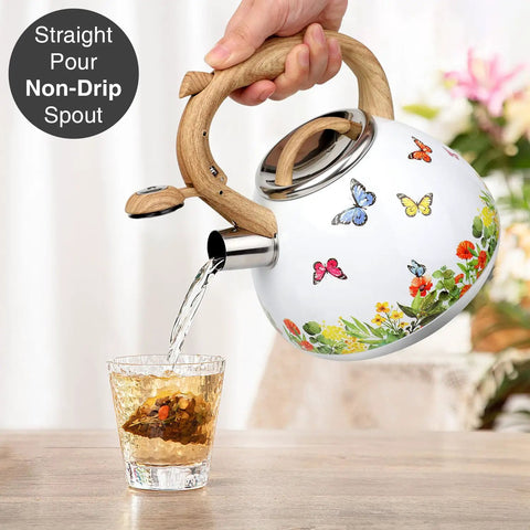 Stovetop Tea Kettle With Wood Pattern Handle, Loud Whistle, 2.7 Quart Food Grade Stainless Steel Pot For Induction And Gas Stoves, Butterfly Design, Rust Resistant, Easy Pour Tea Maker pouring into glass