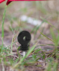 Electric Fence Insulators For Wood Posts With Socket Tool 51Pcs Insulated Fence Hardware Clips shown on wire in grass