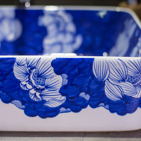 Top Shelf Rectangular Ceramic Vessel Sink With Slick Hand Painted Blue Finish For Above Counter Vanity Setup detailed view of floral design.