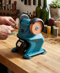 No Nonsense Cordless Mini Bench Grinder With Suction Cup Base And Mounting Holes 2.76 Inch Hole Polisher, blue, on workbench.