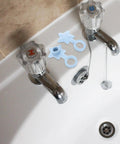 Two 2pcs Silicone Star Shaped Bathtub Stopper Flat Cover for Drain Plug displayed near bathtub faucet, showing color and design.