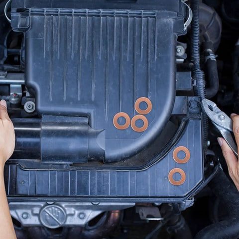 200 Pcs Copper Gasket Washers Assortment Kit for auto body welding on engine component, flat sealing washers visible