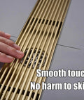 Slick Rectangular Shower Trench Drain With Stainless Steel Grate and Bamboo Hair Strainer, close-up showing smooth touch and drainage.