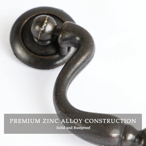 Close-up of Oil Rubbed Bronze Drop Bail Drawer Pull showing bead center, zinc alloy material, 4 inch center to center.