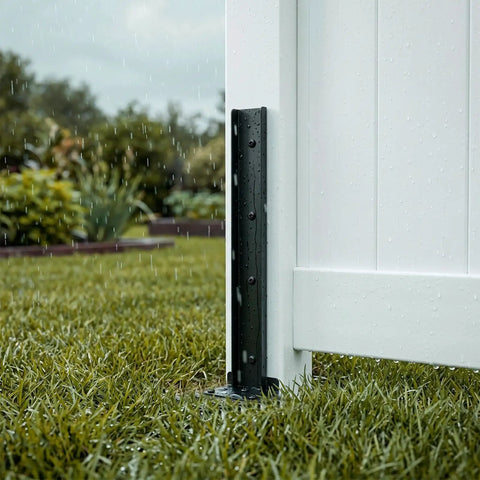 Heavy Duty Fence Post Repair Kit And Quick Fix Stabilizer Bracket installed on a white fence post in rain, providing support.