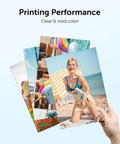 Person holding vibrant photo prints showcasing colors printed by 67XL Printer Ink Replacement For 67 Black And Color Ink Cartridges.
