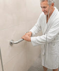 Elderly man using the Super Sturdy 24 Inch Stainless Steel Shower Grab Bar for support in shower.