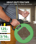 Person holding 125 Ft Non Conductive PET Fish Tape Wire Puller With Three Sixteenth Inch Cable, green ergonomic handle for conduit runs