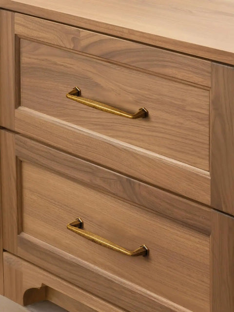 Top Notch Antique Brass Cabinet Pulls 10 Pack Featuring 5 Inch Center Hole Spacing on wooden dresser drawers.